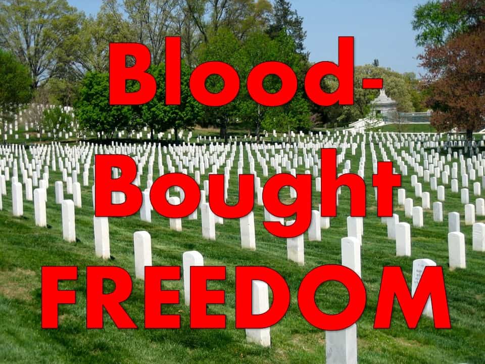 Arlington national cemetery rows of white headstones with text "Blood-Bought Freedom"